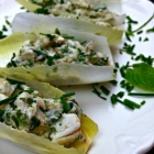 crab salad with lime, mint, and chives on endive